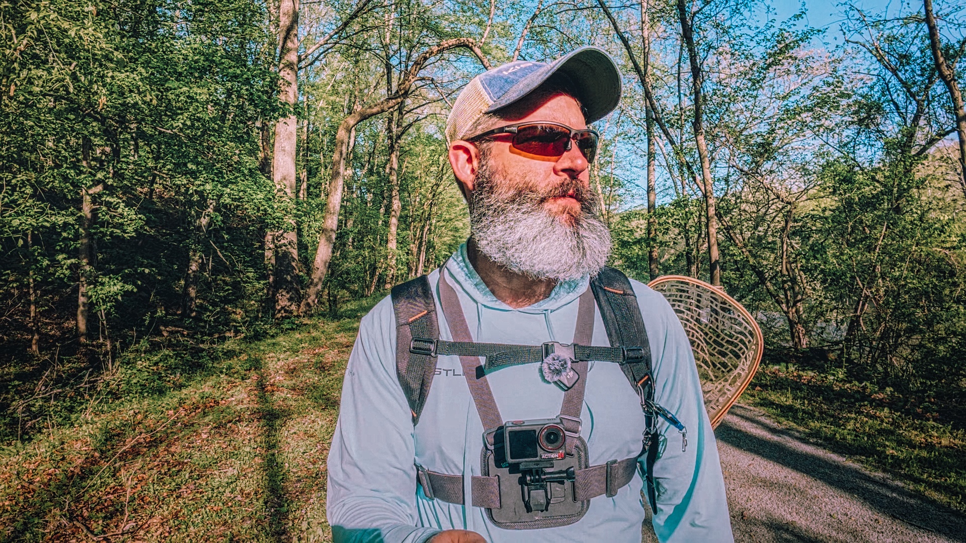 picture of Aaron Hunt hiking to a fishing spot.